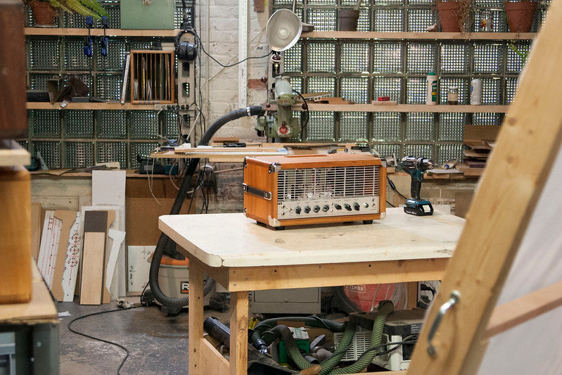 Dean Costello Audio DCA Heavy Metal Warfare HMW workspace workshop woodshed guitar amp tube handmade Dewalt radial arm saw cherry wood pedal platform high gain head
