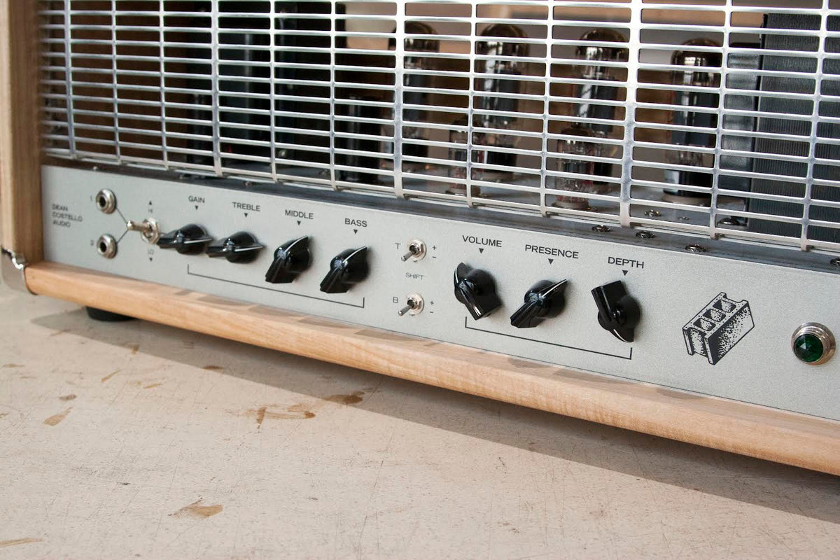 DCA HMW heavy metal warfare amplifier handmade by Dean Costello Audio in Chicago Illinois made in USA control panel close up photograph cinder block